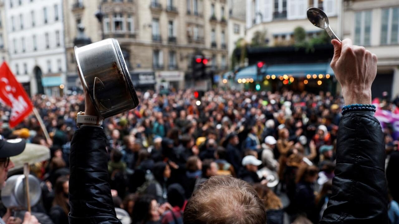 Macron’s action plan ‘rings hollow’ as critics take to streets banging pots and pans