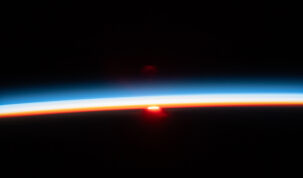 The sun's last rays illuminate Earth's atmosphere in this photograph of an orbital sunset from the International Space Station as it soared 261 miles above the Pacific Ocean off the northern coast of Japan.