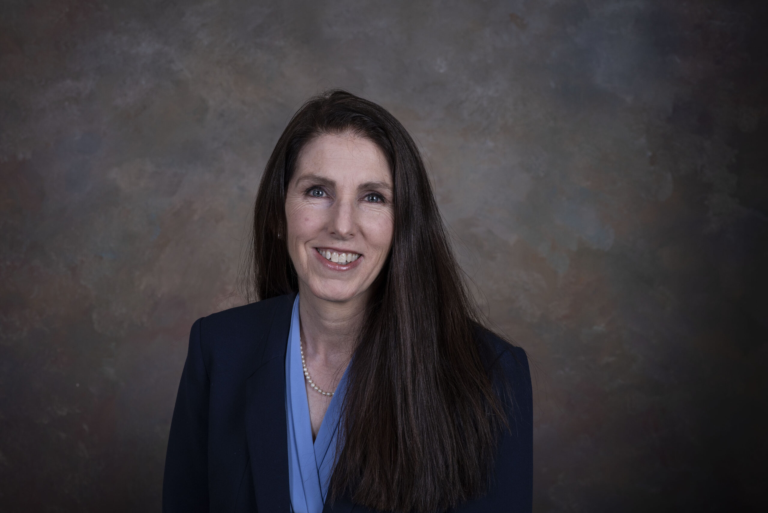 Rae Ann Meyer headshot of a women with long brown hair