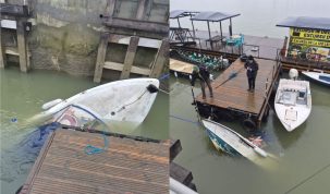 Ambarcațiune de agrement parțial scufundată lângă un ponton de pe faleză